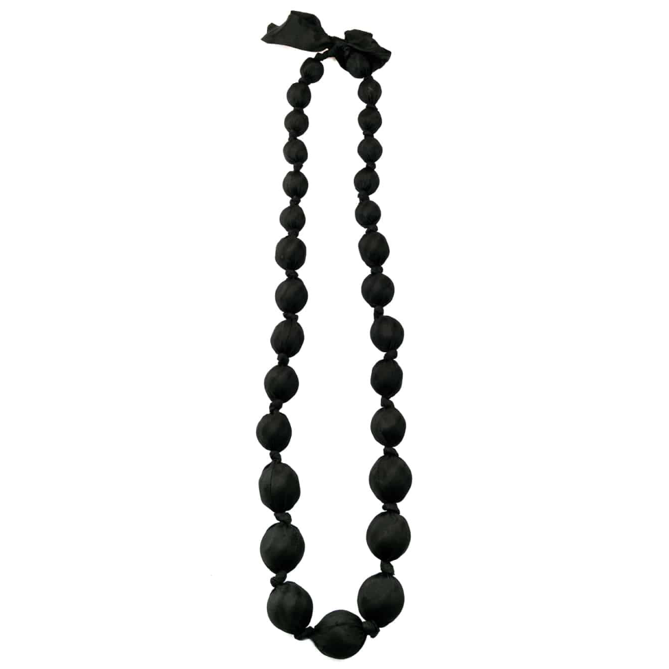 A black beaded necklace with large, matte spherical beads and a matching black ribbon bow at the top, shown against a plain white background.