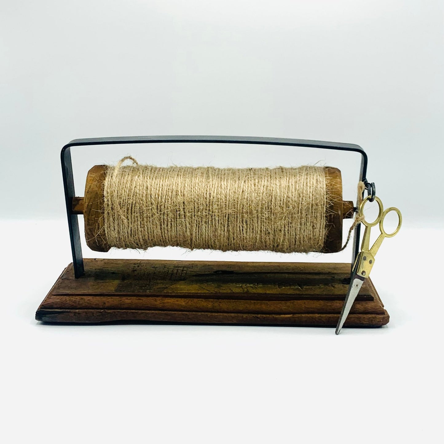 Hemp string spool with scissors on wooden stand – Amo and Pax