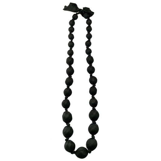 A black beaded necklace with large, matte spherical beads and a matching black ribbon bow at the top, shown against a plain white background.
