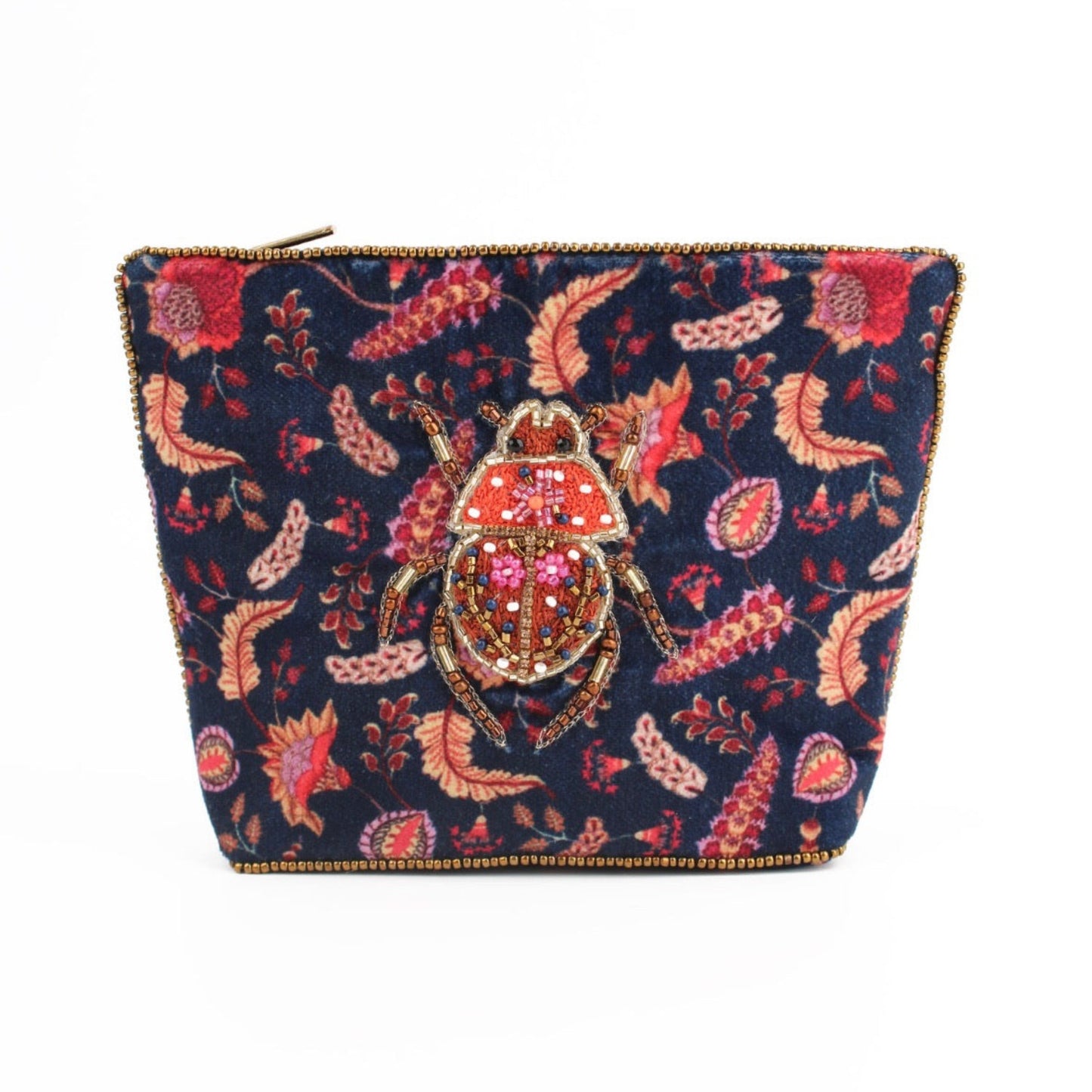 Embroidered clutch bag with beetle design on a floral patterned background