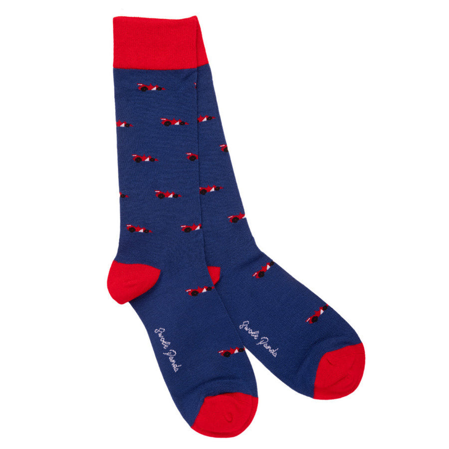 Blue socks with red accents and small patterns on a white background