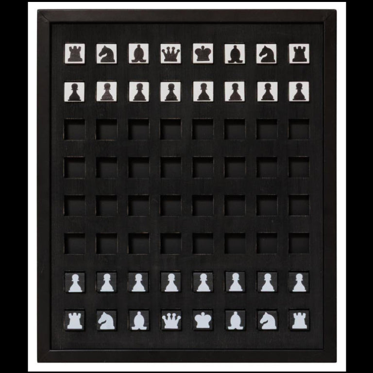 Framed display of black and white chess pieces on a black background